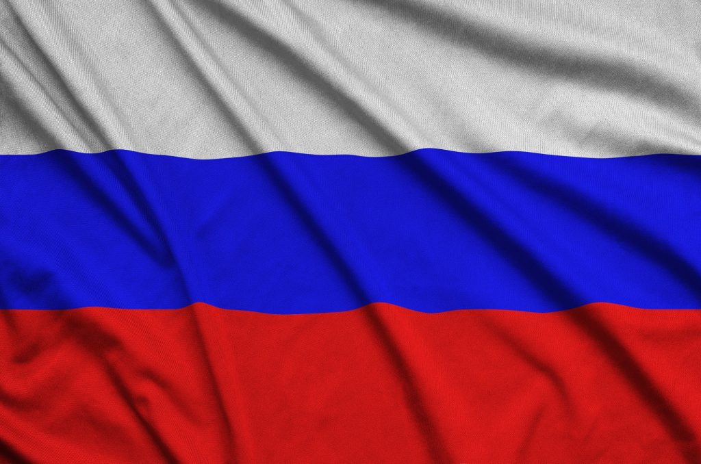 Russia flag is depicted on a sports cloth fabric with many folds. Sport team waving banner